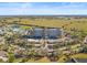 Aerial view of the condo complex surrounded by lush green space, golf course and several ponds at 2320 Terra Ceia Bay Blvd # 406, Palmetto, FL 34221