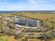 An aerial view of Terra Ceia Club Condo featuring lush landscaping, golf course, and water features at 2320 Terra Ceia Bay Blvd # 406, Palmetto, FL 34221