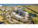 Aerial view of the community showcasing the building's architecture, surrounding golf course and water views at 2320 Terra Ceia Bay Blvd # 406, Palmetto, FL 34221