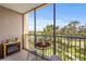 Relaxing screened balcony with outdoor furniture and views of the surrounding golf course at 2320 Terra Ceia Bay Blvd # 406, Palmetto, FL 34221