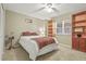 Bedroom featuring a ceiling fan, built-in shelves, and carpeted floors at 2320 Terra Ceia Bay Blvd # 406, Palmetto, FL 34221