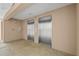 Hallway featuring stainless steel elevators with speckled floors at 2320 Terra Ceia Bay Blvd # 406, Palmetto, FL 34221