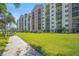 Exterior showcasing a modern building and lush green lawns with sidewalk on beautiful day at 2320 Terra Ceia Bay Blvd # 406, Palmetto, FL 34221