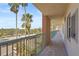 Outdoor hallway view showcasing the complex's design with palm tree scenery at 2320 Terra Ceia Bay Blvd # 406, Palmetto, FL 34221