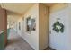 Hallway leading to the entrance door, decorated with a wreath and featuring well-maintained exteriors at 2320 Terra Ceia Bay Blvd # 406, Palmetto, FL 34221