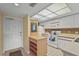 Well-lit kitchen featuring modern appliances, including a white range and microwave, and tiled flooring at 2320 Terra Ceia Bay Blvd # 406, Palmetto, FL 34221