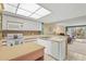 Cozy kitchen featuring white appliances, ample countertop space, and an open layout to the living area at 2320 Terra Ceia Bay Blvd # 406, Palmetto, FL 34221
