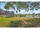 Scenic pond view featuring a gazebo island, bridge, and lush green lawn at 2320 Terra Ceia Bay Blvd # 406, Palmetto, FL 34221