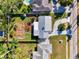 Bird's eye view of backyard with custom deck, stepping stones, and tropical trees at 2341 Siesta Dr, Sarasota, FL 34239