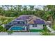 Aerial view of the property featuring a screened-in pool and solar panels at 2625 Yuma Ave, North Port, FL 34286