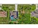 Aerial view of the property showcasing the roof, solar panels, backyard, and proximity to local streets at 2625 Yuma Ave, North Port, FL 34286