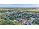 Aerial view of a tree-lined neighborhood with lush greenery and blue skies at 2625 Yuma Ave, North Port, FL 34286