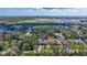 A beautiful neighborhood showcasing lush landscaping, many trees, and clear blue skies at 2625 Yuma Ave, North Port, FL 34286