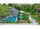 Well-manicured backyard with screened pool, solar panels, and artificial turf at 2625 Yuma Ave, North Port, FL 34286