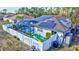 Secluded backyard featuring a screened-in pool, solar panels, and a newly constructed white fence at 2625 Yuma Ave, North Port, FL 34286