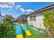 Backyard with green space, outdoor patio and screened-in pool at 2625 Yuma Ave, North Port, FL 34286