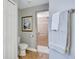 Bathroom featuring a toilet, towel rack, and glass-enclosed walk-in shower at 2625 Yuma Ave, North Port, FL 34286