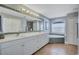 Bathroom featuring a double vanity, jacuzzi tub, and natural lighting at 2625 Yuma Ave, North Port, FL 34286