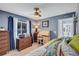 Comfortable bedroom with a workstation, ample natural light, and serene decor at 2625 Yuma Ave, North Port, FL 34286