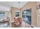 Dining area has wood floors and sliding glass door view of the pool area at 2625 Yuma Ave, North Port, FL 34286