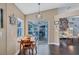 Cozy dining area with wood table and chairs, leading to an outdoor patio at 2625 Yuma Ave, North Port, FL 34286