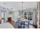 Charming dining area with hardwood floors and a view of the landscaped outdoor area at 2625 Yuma Ave, North Port, FL 34286