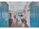 Inviting entryway with dark wood floors leading into a bright living area at 2625 Yuma Ave, North Port, FL 34286