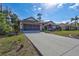 Well maintained single-story home with a front yard, driveway, and two car garage at 2625 Yuma Ave, North Port, FL 34286