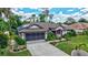 Lovely one-story home with a well-kept lawn, screened garage, solar panel and beautiful landscaping at 2625 Yuma Ave, North Port, FL 34286