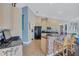 Spacious kitchen with granite countertops, stainless steel appliances, and a breakfast bar with comfortable seating at 2625 Yuma Ave, North Port, FL 34286