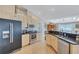 Modern kitchen with stainless steel appliances, granite countertops, and light wood cabinetry at 2625 Yuma Ave, North Port, FL 34286