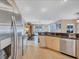 Bright kitchen featuring stainless steel appliances, granite countertops, and an open layout at 2625 Yuma Ave, North Port, FL 34286