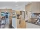 Open-concept kitchen with granite counters, stainless steel appliances, and seamless access to dining area at 2625 Yuma Ave, North Port, FL 34286