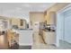Spacious kitchen with a breakfast bar, stainless steel appliances, and easy access to the hallway at 2625 Yuma Ave, North Port, FL 34286