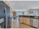 Open-concept kitchen boasts granite countertops, stainless steel appliances, and ample cabinet space at 2625 Yuma Ave, North Port, FL 34286