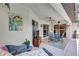 Well-decorated covered lanai with a dining set and comfortable lounge seating at 2625 Yuma Ave, North Port, FL 34286