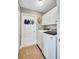 A convenient laundry room with modern appliances and storage cabinets for efficient organization at 2625 Yuma Ave, North Port, FL 34286