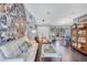 Bright, open concept living room with hardwood floors connecting to dining area at 2625 Yuma Ave, North Port, FL 34286