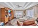 Comfortable living room with a large white sectional sofa and coffered ceilings at 2625 Yuma Ave, North Port, FL 34286