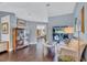Bright living room featuring hardwood floors, neutral wall colors, and an outdoor view at 2625 Yuma Ave, North Port, FL 34286