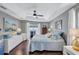 Bedroom with a plush bed, dresser, natural lighting, and soft, neutral tones at 2625 Yuma Ave, North Port, FL 34286