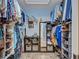 Spacious walk-in closet with custom shelving and storage for optimal organization and style at 2625 Yuma Ave, North Port, FL 34286
