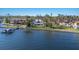 Stunning waterfront home surrounded by lush landscaping, private boat dock, and beautiful water views at 2828 Riverview Blvd, Bradenton, FL 34205