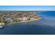 Expansive waterfront property showcasing multiple luxury homes along the scenic coastline with serene blue waters at 2828 Riverview Blvd, Bradenton, FL 34205
