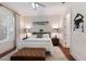 Bright bedroom with a ceiling fan, a large window, hardwood floors, and neutral decor at 2828 Riverview Blvd, Bradenton, FL 34205