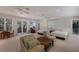 Spacious multi-bed guest room featuring a seating area and natural light at 2828 Riverview Blvd, Bradenton, FL 34205