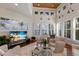 Bright and airy living room with tall ceilings, custom windows and shutters, and a decorative ceiling at 2828 Riverview Blvd, Bradenton, FL 34205