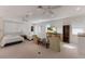Spacious living area featuring two beds, lounge furniture, and bright windows at 2828 Riverview Blvd, Bradenton, FL 34205