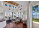 Inviting living room with wood floors, plantation shutters, and water views at 2828 Riverview Blvd, Bradenton, FL 34205