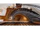 An elevated view of the curved staircase and hardwood floors at 2828 Riverview Blvd, Bradenton, FL 34205